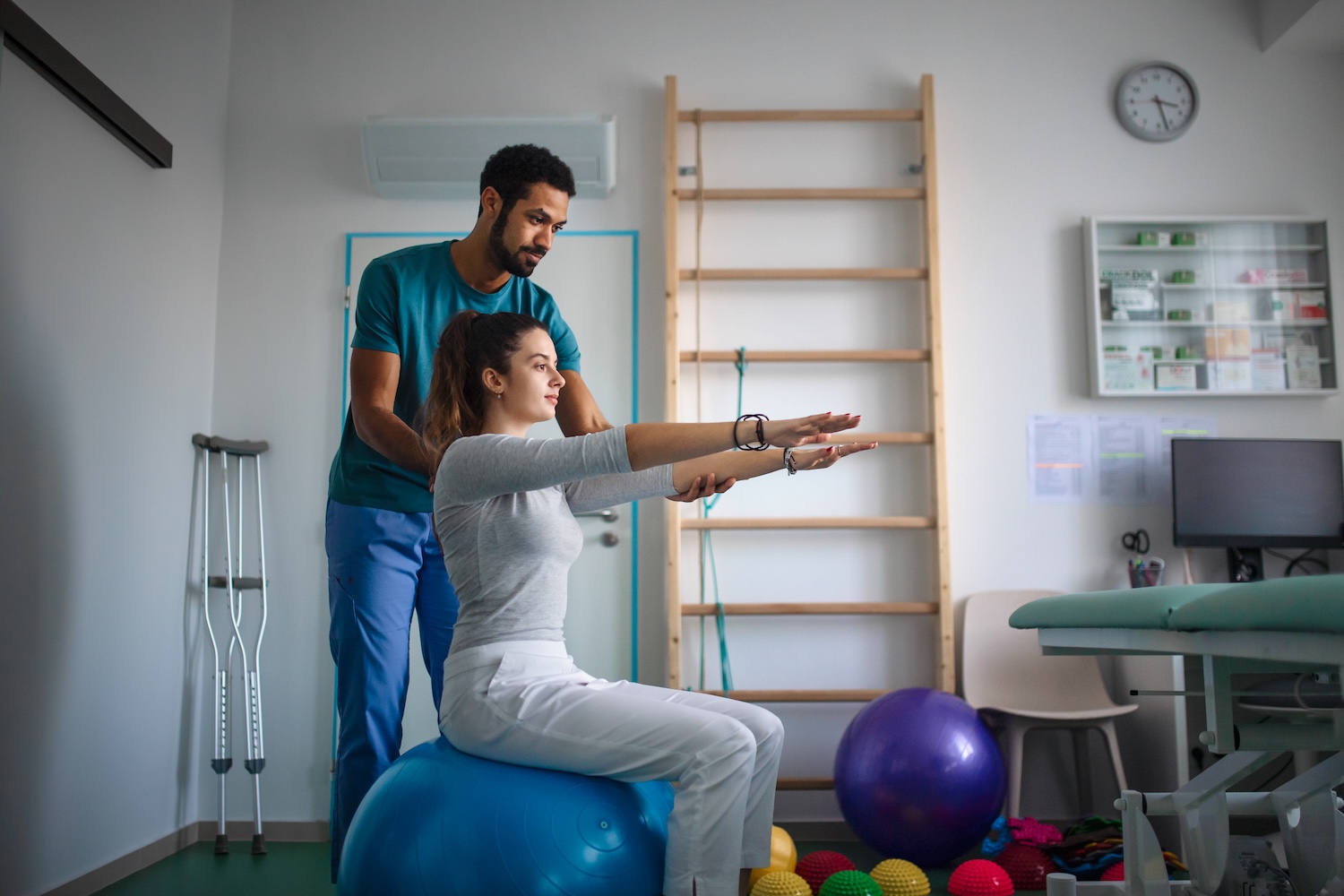 Physiotherapist working with a patient